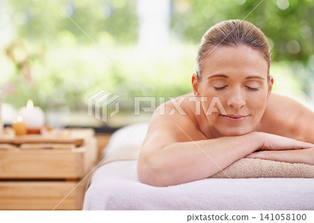 Happy woman, sleeping and relax with towel for spa, zen or massage table at hotel or outdoor resort. Face of female person with smile or enjoying peaceful body treatment at accommodation for wellness Happy woman, sleeping and relax with towel for spa, zen or massage table at hotel or outdoor resort. Face of female person with smile or enjoying peaceful body treatment at accommodation for wellness 141058100