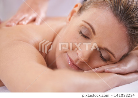 Woman, relax and hands massage in spa, wellness and resting in hotel or lodge. Physical therapy, holistic and female person in holiday or vacation in California for health, peace and back skin detox Woman, relax and hands massage in spa, wellness and resting in hotel or lodge. Physical therapy, holistic and female person in holiday or vacation in California for health, peace and back skin detox 141058254