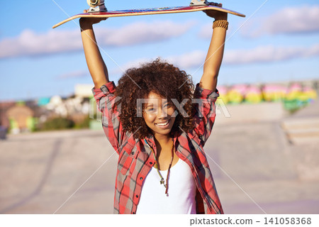Portrait, smile and woman with skateboard for celebration, success or winning with arms raised in city outdoor. Victory, skate park and happy person in casual clothes with achievement in South Africa 141058368