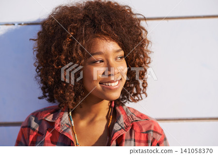 Woman, smile and fashion in outdoor for relax, trendy and casual for comfort, unwind and break for checkered. African person, happy and gorgeous in sun for streetwear in urban for pattern and style Woman, smile and fashion in outdoor for relax, trendy and casual for comfort, unwind and break for checkered. African person, happy and gorgeous in sun for streetwear in urban for pattern and style 141058370