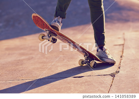 Skateboard, sneaker and person in skatepark for skate, recreation and active for game with wheels. Speed, move and performing for trick, sports and action on ground for toy and balance in summer Skateboard, sneaker and person in skatepark for skate, recreation and active for game with wheels. Speed, move and performing for trick, sports and action on ground for toy and balance in summer 141058389