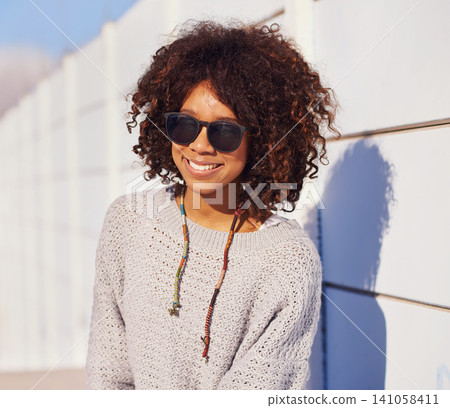 Woman, smile and portrait in city for travel, walk and break in urban for summer, fun and outdoor. African person and happy with glasses for sun, streetwear and journey in town for trip and trendy Woman, smile and portrait in city for travel, walk and break in urban for summer, fun and outdoor. African person and happy with glasses for sun, streetwear and journey in town for trip and trendy 141058411