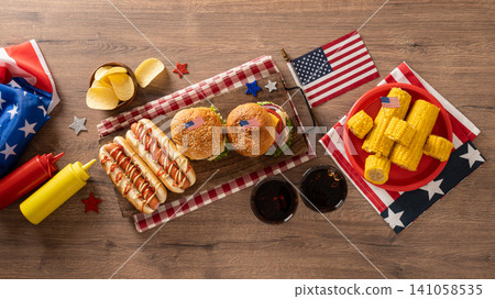 Fourth of July barbecue food flat lay with burgers hot dogs and corn 141058535
