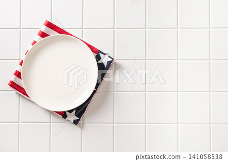 Empty patriotic plate on white background with copy space Empty patriotic plate on white background with copy space 141058538