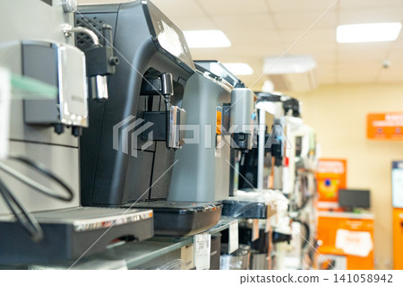A Versatile Display of Modern Espresso Machines Showcasing Various Designs and Features in a Home Appliance Retail Environment 141058942