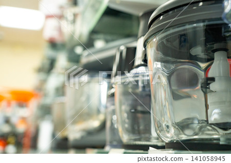 A Diverse Collection of Kitchen Appliances Showcasing Modern Food Processors and Their Versatile Designs in a Functionally Organized Space A Diverse Collection of Kitchen Appliances Showcasing Modern Food Processors and Their Versatile Designs in a Functionally Organized Space 141058945