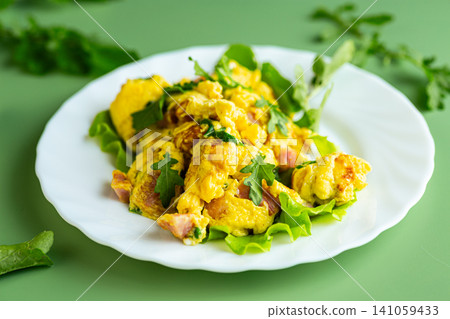 healthy egg breakfast with ham and leafy arugula healthy egg breakfast with ham and leafy arugula 141059433