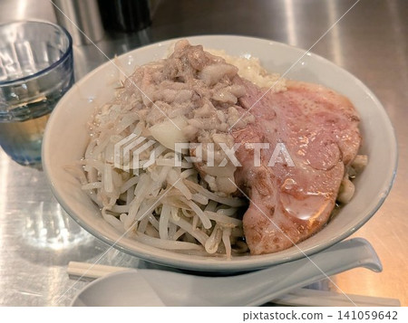 A rich Jiro-style ramen topped with pork back fat and large slices of char siu. A rich Jiro-style ramen topped with pork back fat and large slices of char siu. 141059642