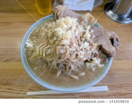 A huge bowl of junk ramen overflowing with volume. A huge bowl of junk ramen overflowing with volume. 141059658