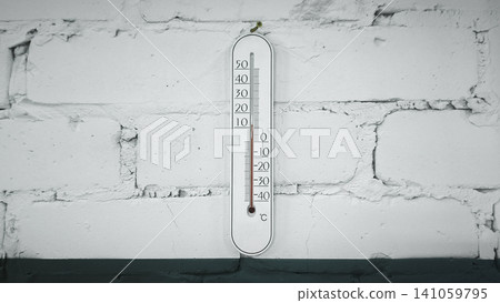 wall-mounted thermometer showing temperature readings in Celsius, wall-mounted thermometer showing temperature readings in Celsius, 141059795