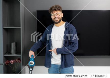 Man showing approval for effective home cleaning Man showing approval for effective home cleaning 141060032