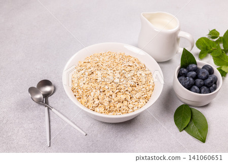 Rolled oats a healthy breakfast with blueberries and milk Rolled oats a healthy breakfast with blueberries and milk 141060651