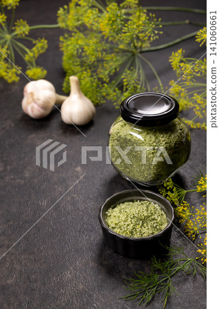 Dill herb salt in jars with garlic Dill herb salt in jars with garlic 141060661