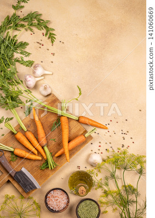 Fresh carrots and cooking ingredients on wooden board 141060669