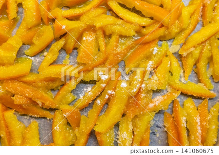 Top view of homemade candied orange peels drying Top view of homemade candied orange peels drying 141060675
