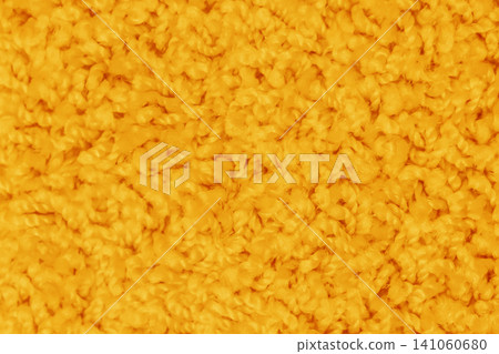Orange-yellow bright vibrant color surface soft carpet pattern texture abstract background structure backdrop 141060680