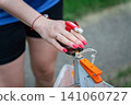 Close up of an orienteering participant using an electronic timing punch 141060727