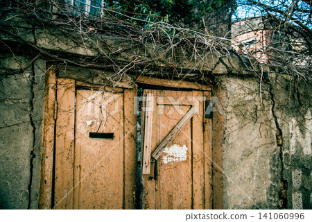 Entrance door small residential house in neighborhood, exterior building outside Entrance door small residential house in neighborhood, exterior building outside 141060996