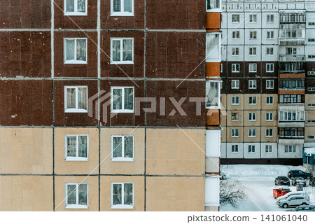 Old ugly shabby Soviet panel residential multi-storey building exterior outside Old ugly shabby Soviet panel residential multi-storey building exterior outside 141061040