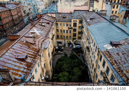 Saint Petersburg, Russia, 25 July 2019, Top view roofs old residential buildings Saint Petersburg, Russia, 25 July 2019, Top view roofs old residential buildings 141061100