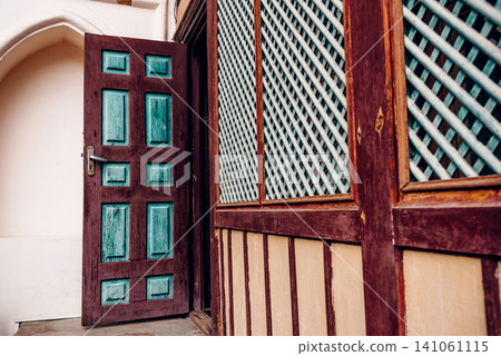 Entrance door small residential house in neighborhood, exterior building outside Entrance door small residential house in neighborhood, exterior building outside 141061115