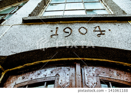 Entrance door small residential house in neighborhood, exterior building outside Entrance door small residential house in neighborhood, exterior building outside 141061188