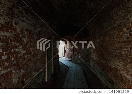 Corridor inside an old stone fortress, fortification, heritage landmark of city Corridor inside an old stone fortress, fortification, heritage landmark of city 141061269
