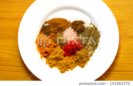 Fresh spices on ceramic plate Fresh spices on ceramic plate 141063570