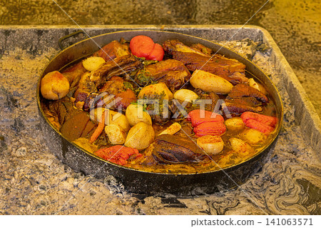 Fresh vegetables and meat cooked in pot Fresh vegetables and meat cooked in pot 141063571