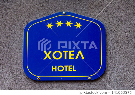 Hotel sign on facade wall Hotel sign on facade wall 141063575