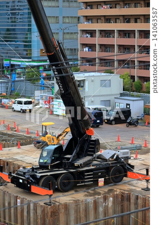 Image of a rough terrain crane at a construction site. Image of a rough terrain crane at a construction site. 141063587