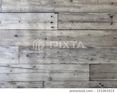 The texture of the reclaimed wood wall has a rich, vintage feel. The texture of the reclaimed wood wall has a rich, vintage feel. 141063919
