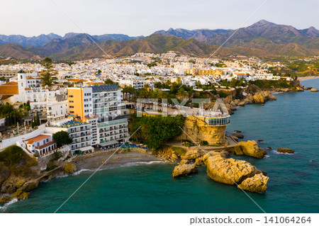 Aerial view of Spanish tourist city of Nerja on Mediterranean coast Aerial view of Spanish tourist city of Nerja on Mediterranean coast 141064264