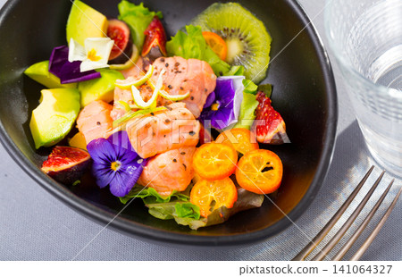 Salmon ceviche with avocado, kiwi and figs Salmon ceviche with avocado, kiwi and figs 141064327
