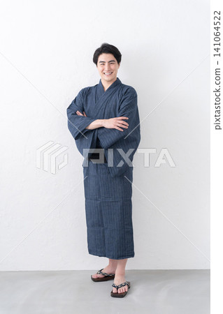 A man wearing a yukata A man wearing a yukata 141064522