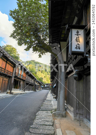 Tsumago-juku, a post town on the Kiso Road (vertical view) Tsumago-juku, a post town on the Kiso Road (vertical view) 141064592