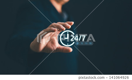 Businessman hand holding glowing 24 hours 7 days service icon with contact channels. Concept of full-time customer support, hotline assistant, constant technical help and round-the-clock commercial Businessman hand holding glowing 24 hours 7 days service icon with contact channels. Concept of full-time customer support, hotline assistant, constant technical help and round-the-clock commercial 141064926