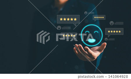 Businessman hand holding virtual happy smile face icon with five star rating feedback for excellent customer service evaluation, satisfaction survey, experience marketing and business reputation Businessman hand holding virtual happy smile face icon with five star rating feedback for excellent customer service evaluation, satisfaction survey, experience marketing and business reputation 141064928