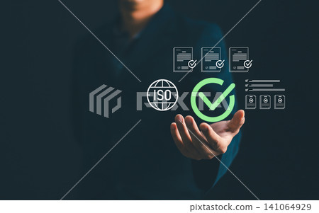 Businessman showing ISO standard quality management certification and assurance icon, guarantee compliance with international regulations and corporate business excellence workflow Businessman showing ISO standard quality management certification and assurance icon, guarantee compliance with international regulations and corporate business excellence workflow 141064929