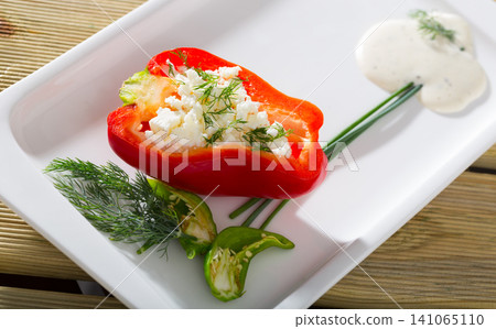 Stuffed half of pepper with brynza, dish of Bulgarian cuisine Stuffed half of pepper with brynza, dish of Bulgarian cuisine 141065110