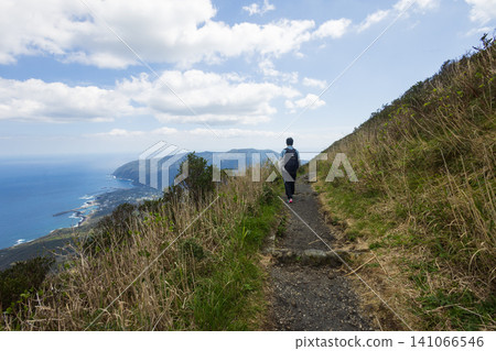 The back view of a student climbing Mount Hachijo-Fuji The back view of a student climbing Mount Hachijo-Fuji 141066546