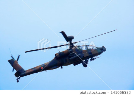 A flying AH-64D Apache Longbow attack helicopter. A flying AH-64D Apache Longbow attack helicopter. 141066583
