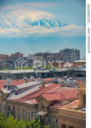 Vertical Yerevan cityscape with red roofs and mount Ararat in clouds with copy space Vertical Yerevan cityscape with red roofs and mount Ararat in clouds with copy space 141066649