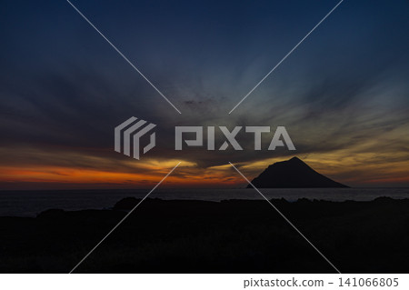 A spectacular view of Hachijo-kojima Island and the sunset from Minami-Senjojiki. A spectacular view of Hachijo-kojima Island and the sunset from Minami-Senjojiki. 141066805