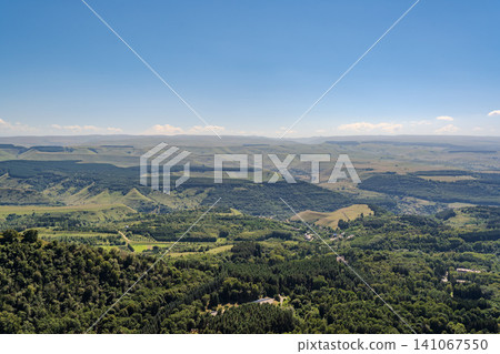 Panoramic view of the green valley and the snowy peak of Mount Elbrus on the horizon against the blue sky on a sunny clear morning in Kislovodsk Stavropol territory, Russia Panoramic view of the green valley and the snowy peak of Mount Elbrus on the horizon against the blue sky on a sunny clear morning in Kislovodsk Stavropol territory, Russia 141067550