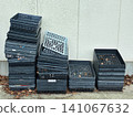 Plastic containers stacked outdoors (seedling trays, agricultural supplies, storage) 141067632