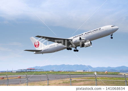 A Japan Airlines Boeing 767 passenger aircraft (low key) taking off from Izumo Airport. A Japan Airlines Boeing 767 passenger aircraft (low key) taking off from Izumo Airport. 141068634
