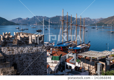 Ancient castle walls and pirate ships in Marmaris Turkey Ancient castle walls and pirate ships in Marmaris Turkey 141068846
