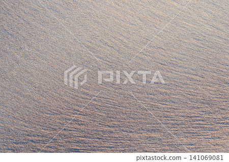 Natural Seashore Sand Texture Background with Fine Ripple Patterns on a Clean Sandy Beach Surface Texture 141069081