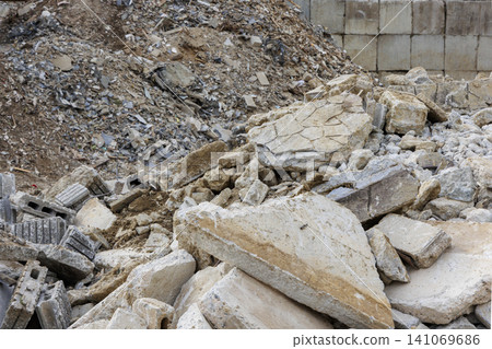 Demolition site piles of concrete fragments and block rubble Demolition site piles of concrete fragments and block rubble 141069686
